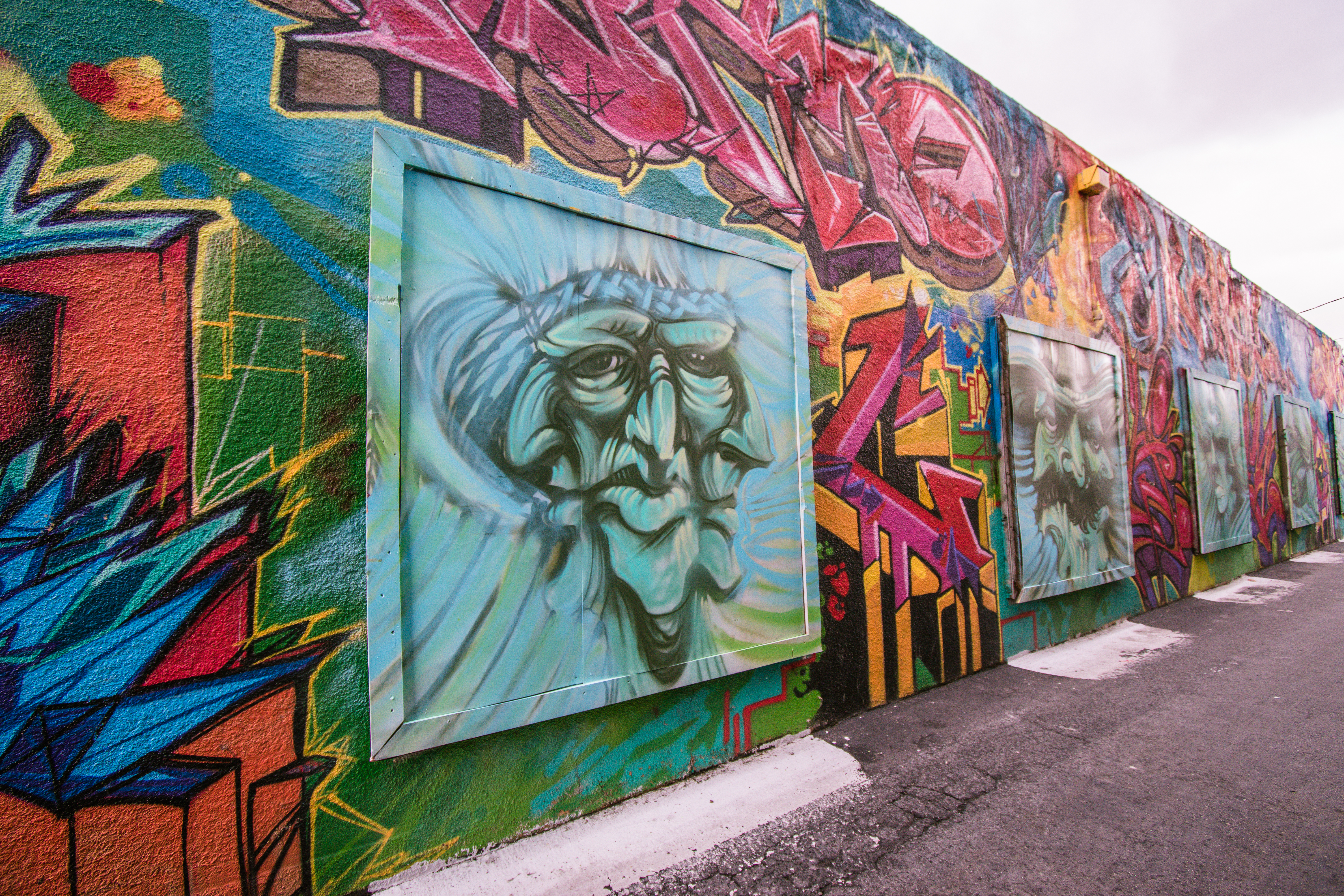 Colorful street art in Salt Lake City featuring faces